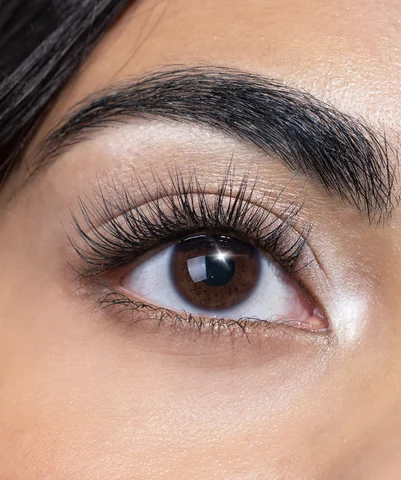 Lifted, curled natural lashes around a dark brown eye