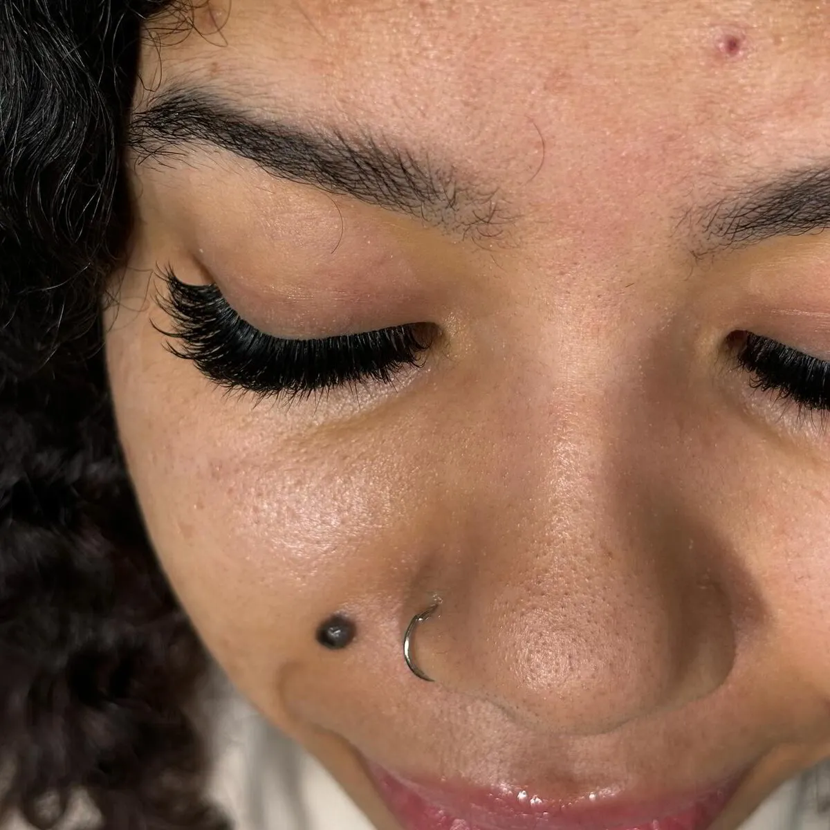 Hybrid mega volume lash extensions on closed eyes